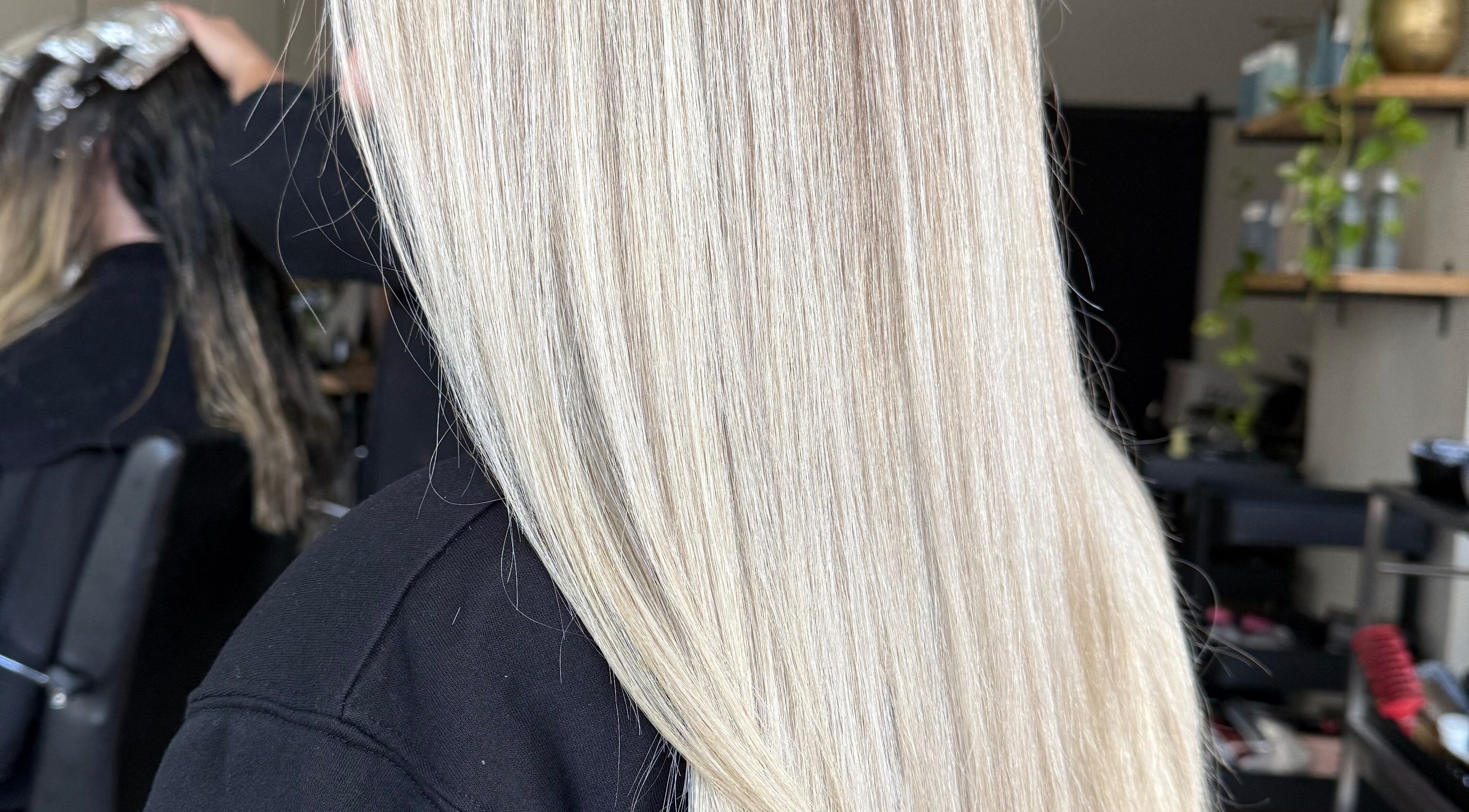 Sleek blonde hair styling at Jazzy Cutz, St Catharines, Ontario, CA, highlighting smooth straight layers.