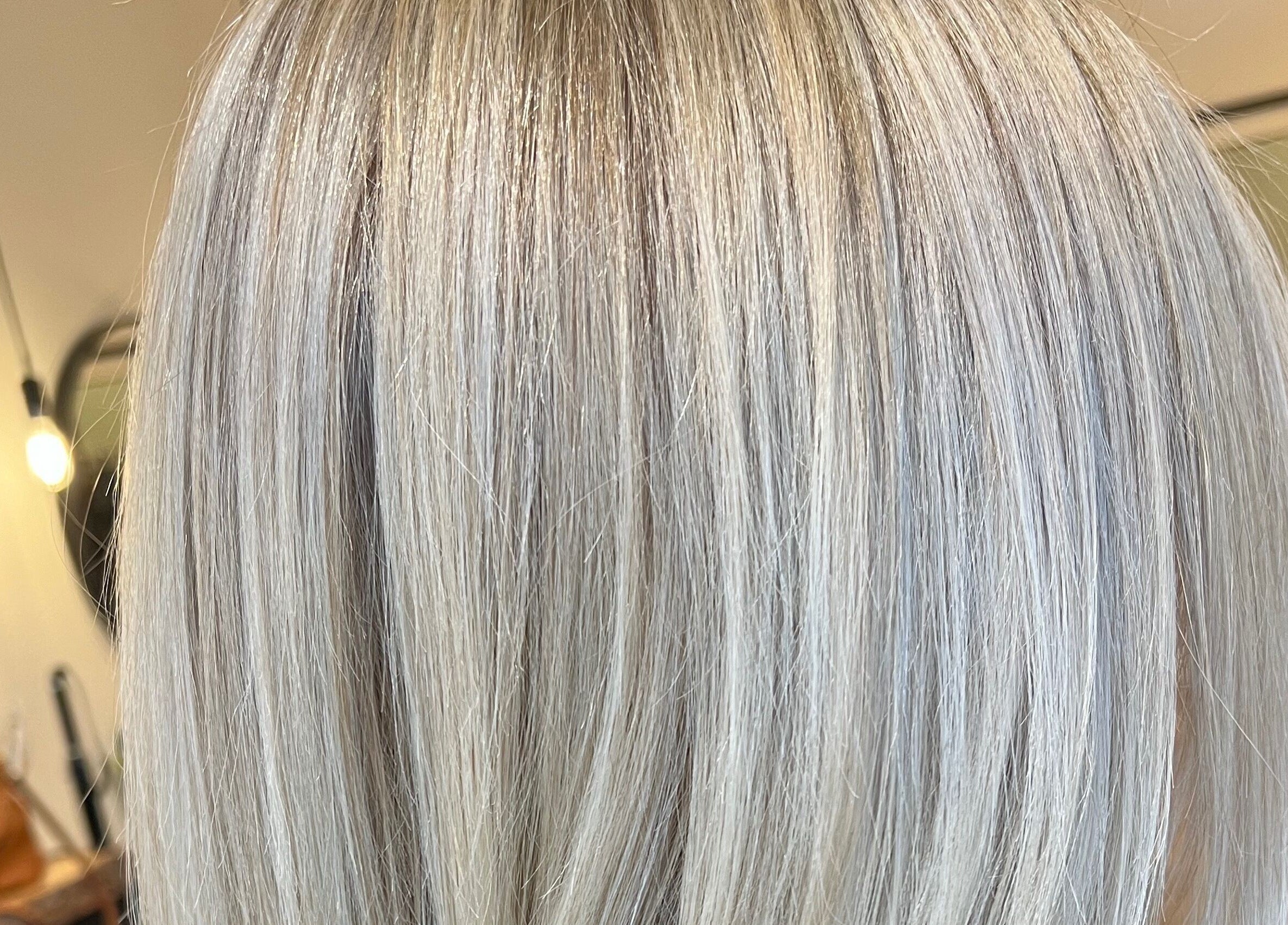 Elegant blonde hair styled at Jazzy Cutz in St Catharines, Ontario, CA.