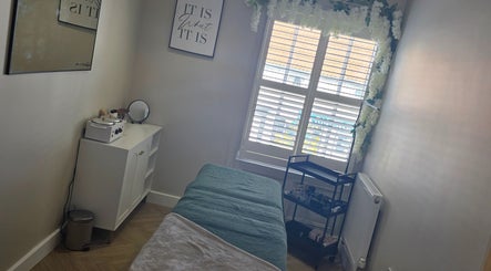 Tranquil treatment room at Yorkshire Hair and Beauty MARKET STREET, Pocklington, England, GB, with a massage table.