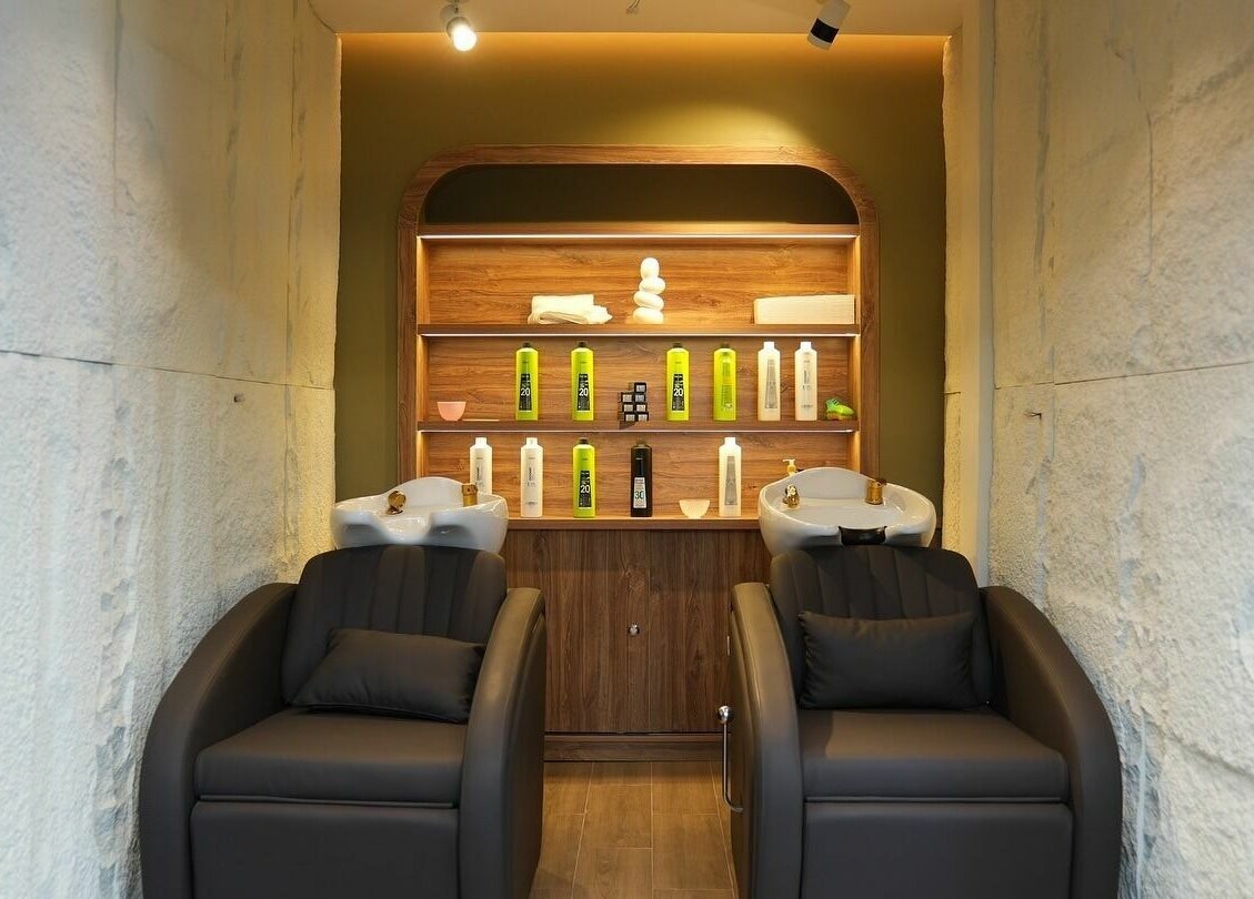 Modern hair wash station at The Hair and Beyond Salon, Jeddah, Makkah Province, SA with luxury chairs.