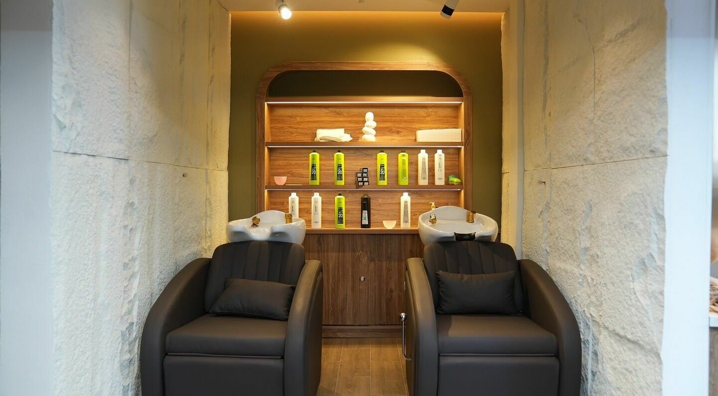 Modern hair wash station at The Hair and Beyond Salon, Jeddah, Makkah Province, SA with luxury chairs.