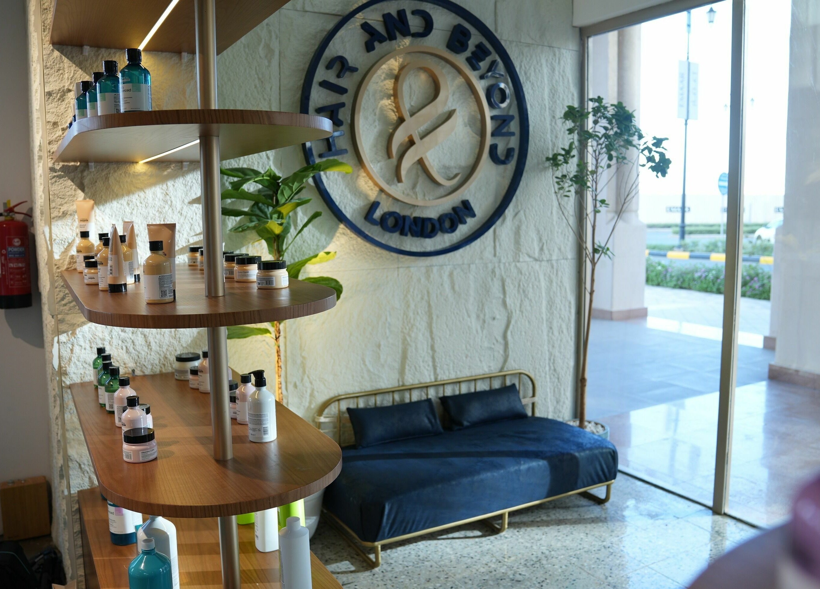 Shelf with products at The Hair and Beyond Salon, inviting ambiance in Jeddah, Makkah Province, SA.