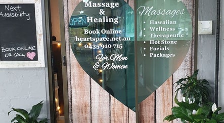 Entrance of HeartSpace Massage & Healing in Tallebudgera, Queensland, AU with services listed on the door.