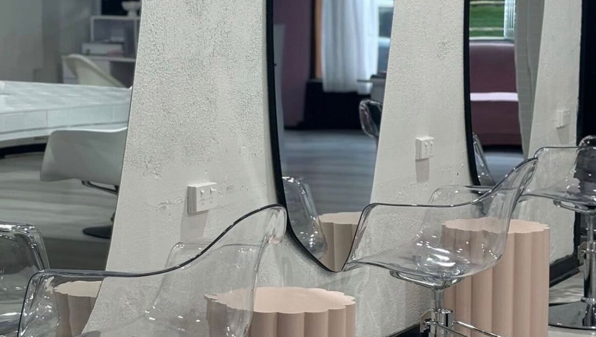 Modern salon interior with chic mirrors and chairs at Stranded by Anette, Islington, New South Wales, AU.