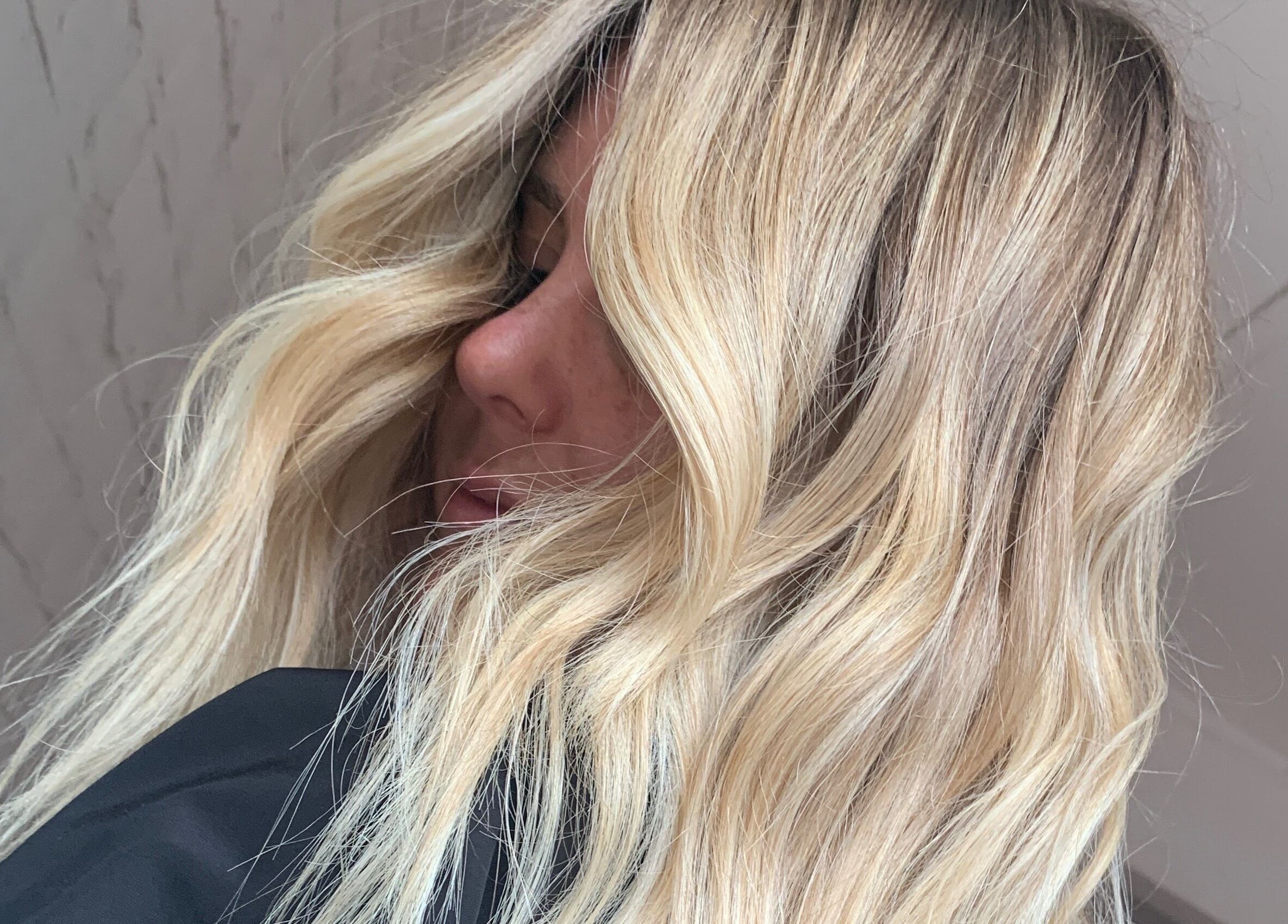 Blonde hair styled in waves at Stranded by Anette, Islington, New South Wales, AU.
