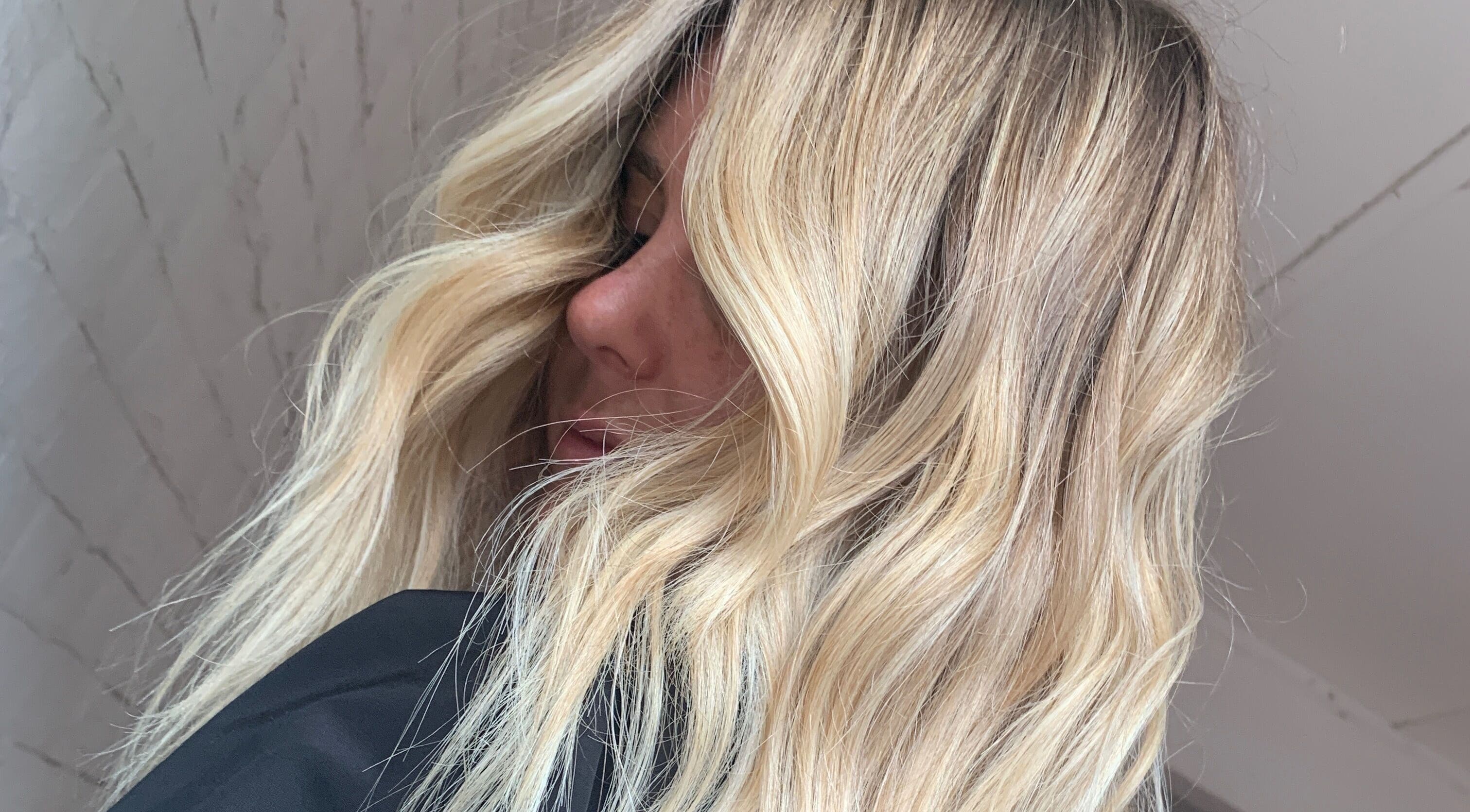Blonde hair styled in waves at Stranded by Anette, Islington, New South Wales, AU.