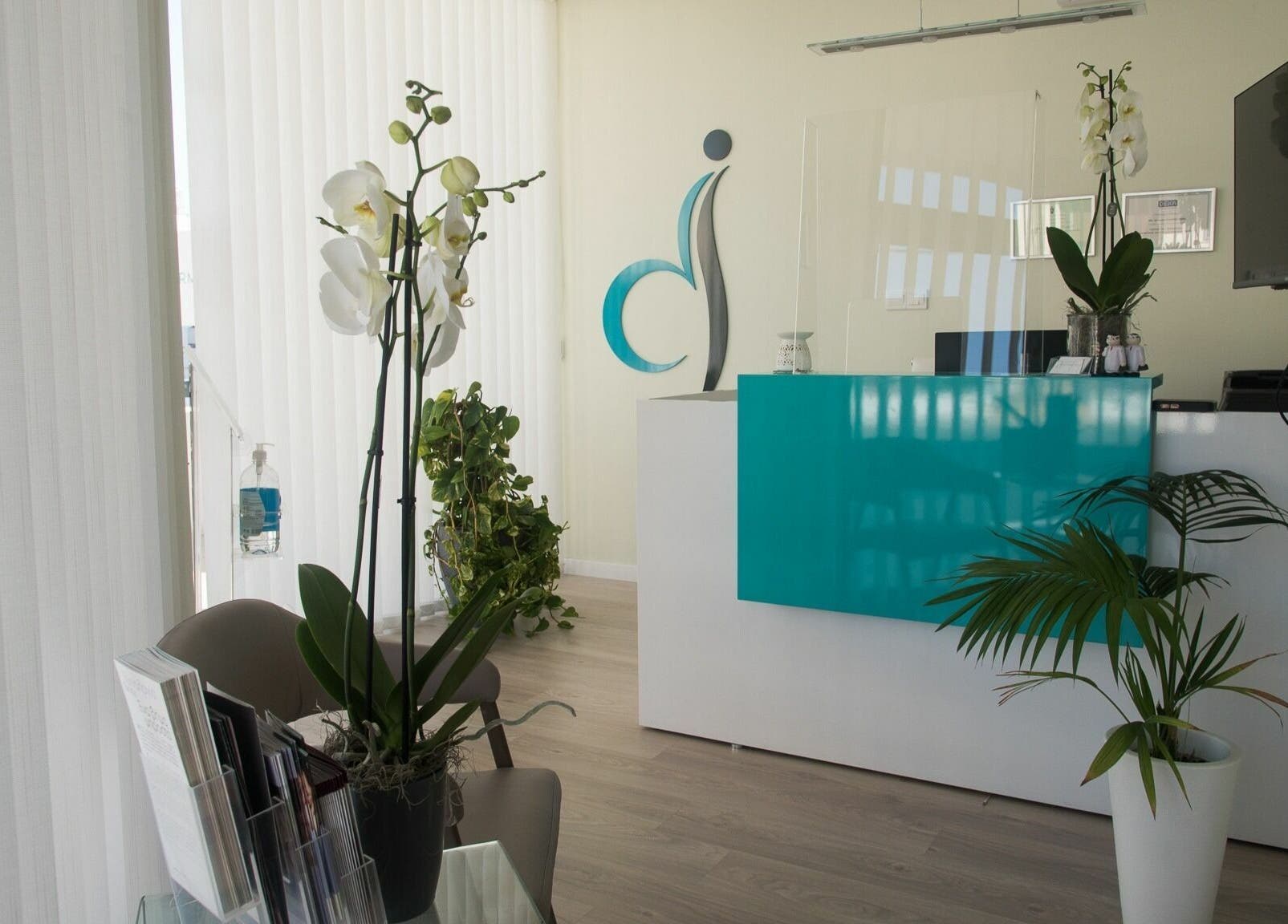 Elegant lobby of Derma Laser Beauty Lounge in Paralimni, Famagusta, CY with sleek decor and lush plants.