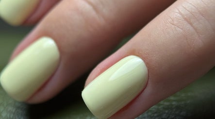 Close-up of a lemon yellow manicure at BrowChuk by Vlada, London, England, GB.