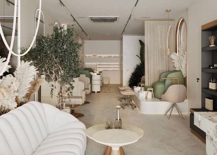 Luxurious interior of BrowChuk by Vlada, London, England, GB; elegant seating, greenery, and chic decor.