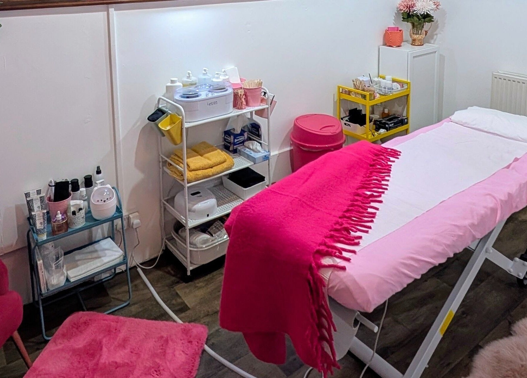 Elegant beauty treatment room at Smooth & Polished by Mercedez in Swaffham, England, GB, with pink decor.