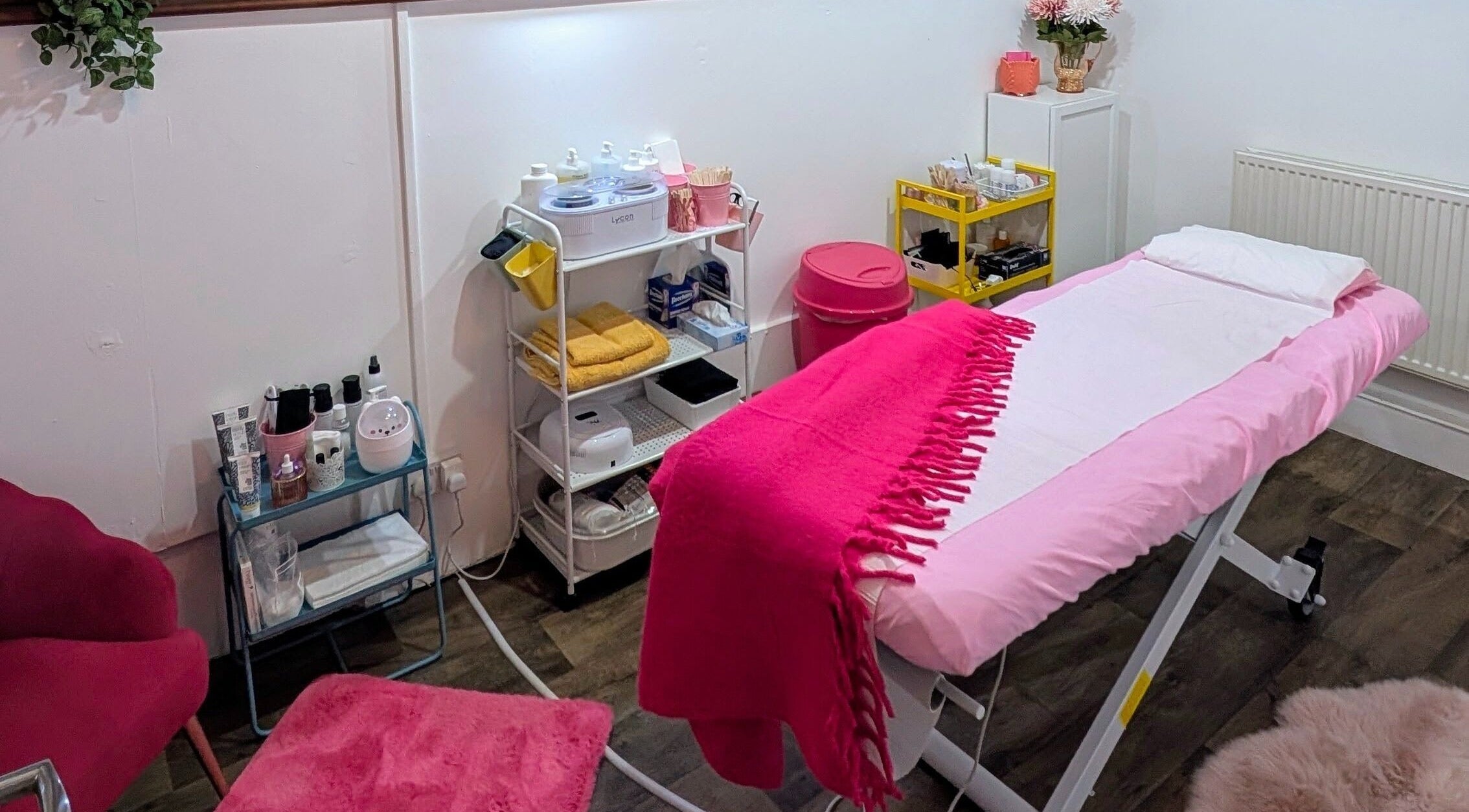 Elegant beauty treatment room at Smooth & Polished by Mercedez in Swaffham, England, GB, with pink decor.