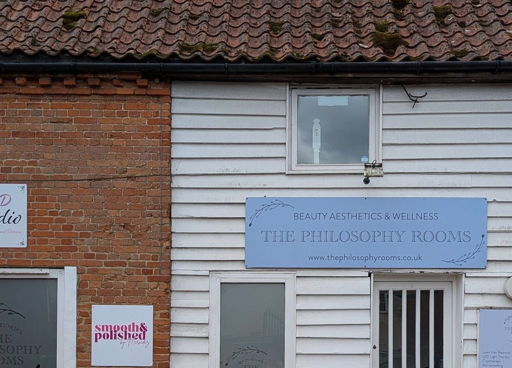 Exterior view of Smooth & Polished by Mercedez, Swaffham, England, GB, featuring signage and brick facade.