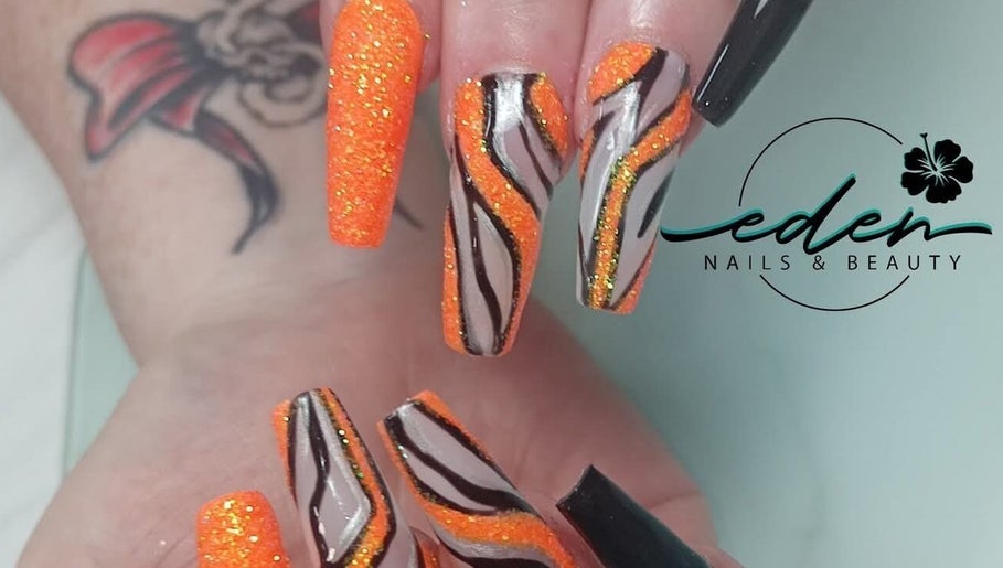 Bold orange and black tiger stripe nail design at Eden Nails & Beauty, Glasgow, GB.