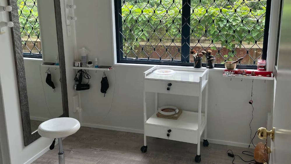 Cozy beauty room at Meena’s Beauty & Skincare in Auckland, NZ with natural light and elegant décor.
