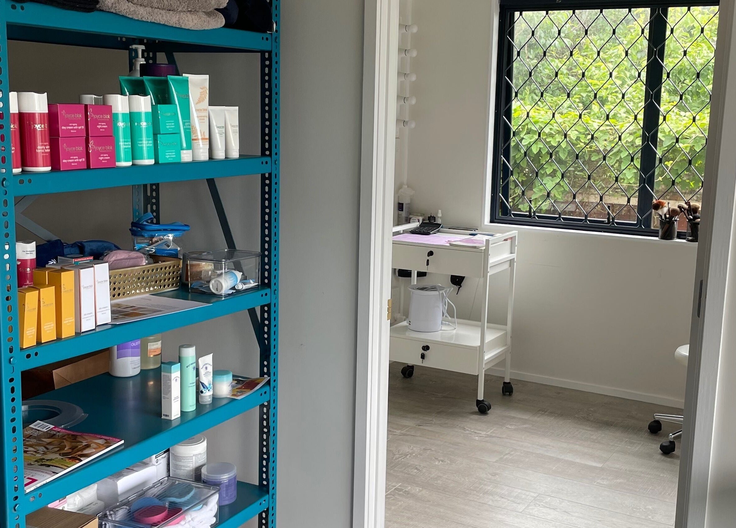 Product shelves at Meena’s Beauty & Skincare, Auckland, NZ showcasing a bright and organized skincare space.