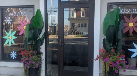 Prohibited Face and Body Bar entrance with vibrant flowers in Quakertown, Pennsylvania, US.