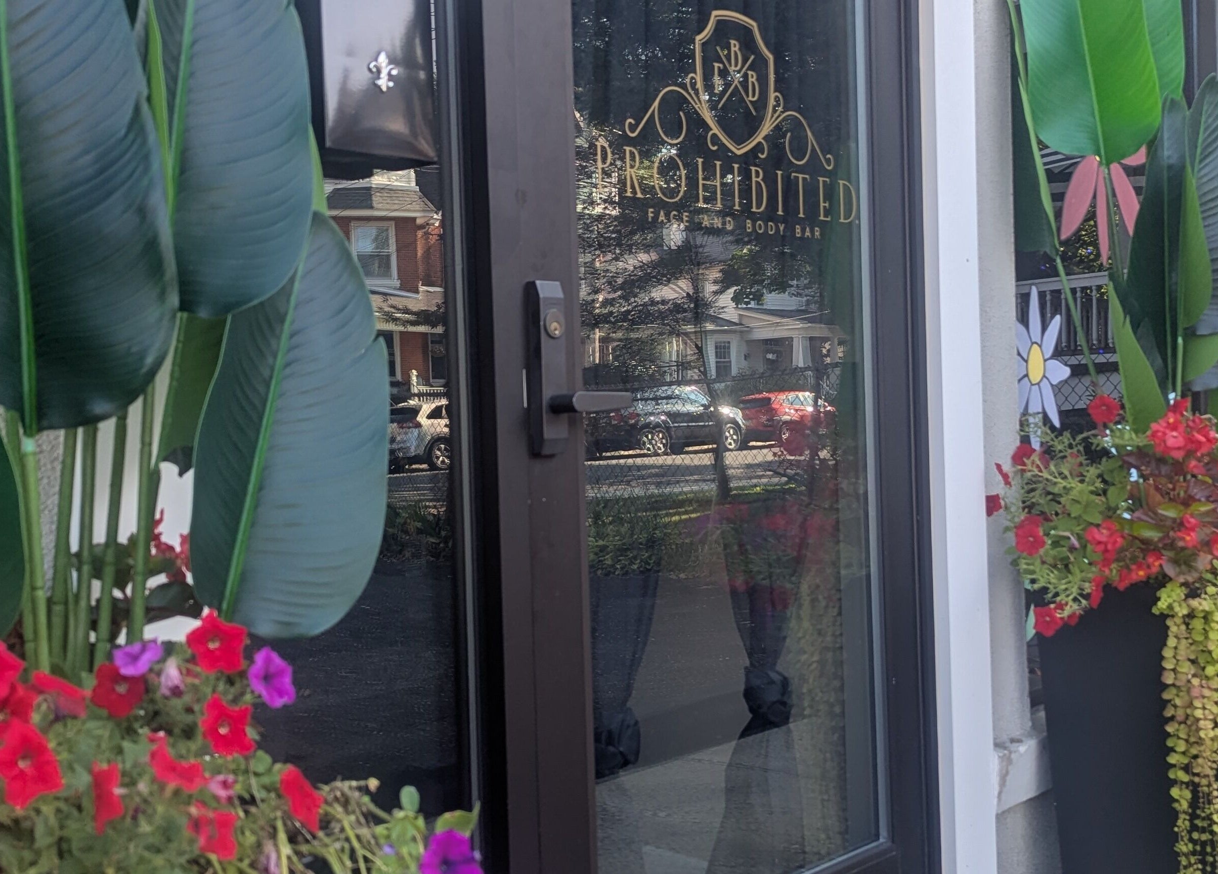 Prohibited Face and Body Bar's entrance with floral decor in Quakertown, Pennsylvania, US.