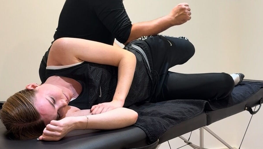 Relaxing massage session at TheMassageWorks, London, England, GB with a client on a therapy table.