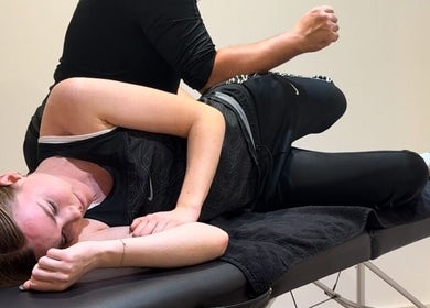 Relaxing massage session at TheMassageWorks, London, England, GB with a client on a therapy table.