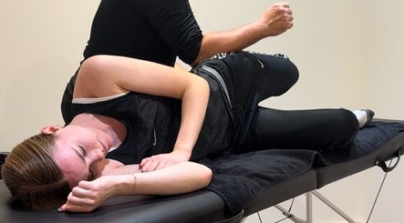 Relaxing massage session at TheMassageWorks, London, England, GB with a client on a therapy table.