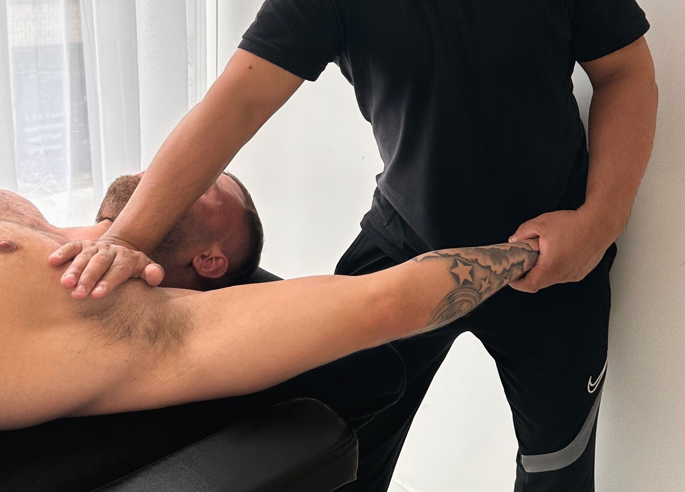 Therapist performing massage at TheMassageWorks (Finsbury Park) in London, England, GB.