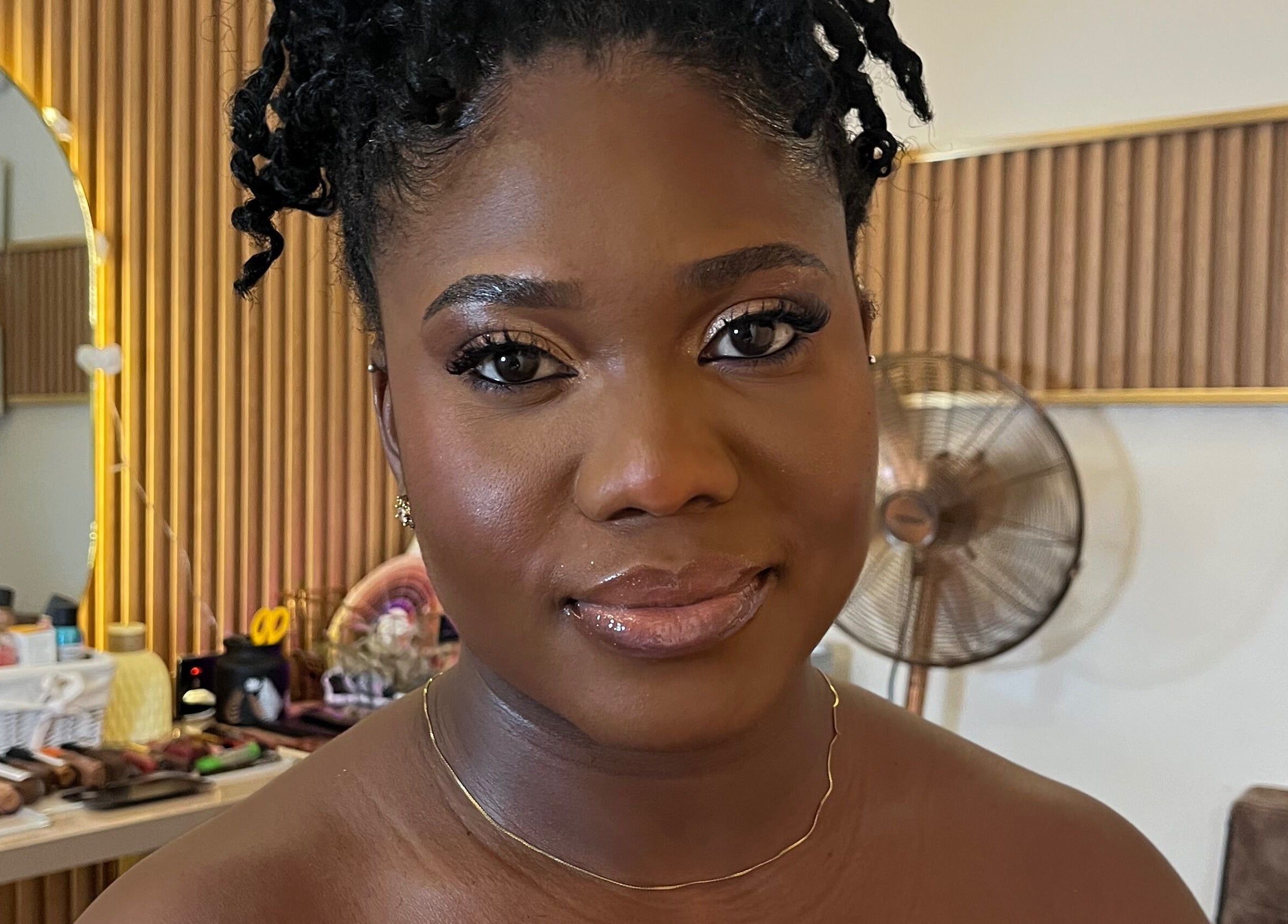 Smiling woman with styled hair at Lovevbeauty Beauty/Content Studio in Accra, Greater Accra Region, GH.