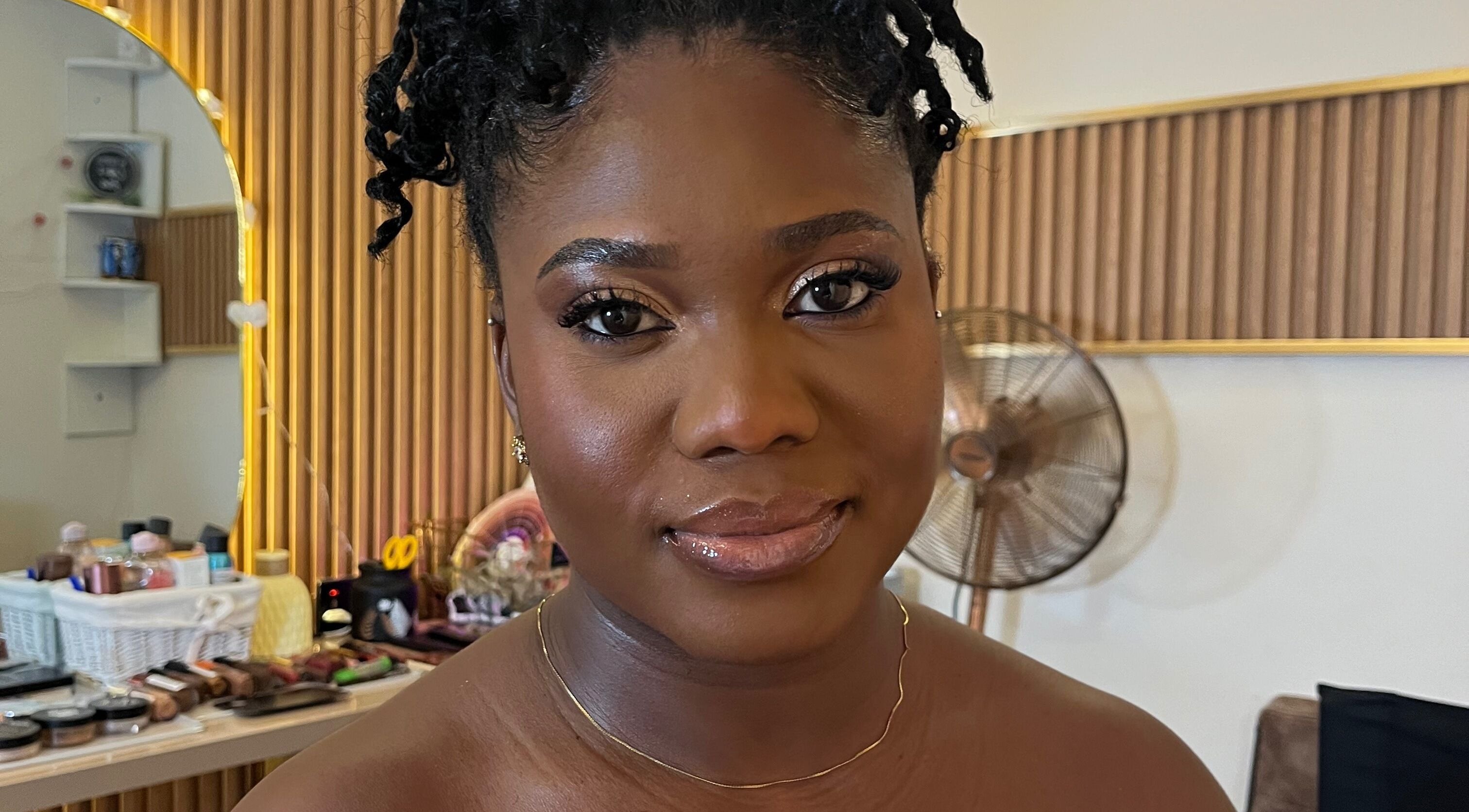 Smiling woman with styled hair at Lovevbeauty Beauty/Content Studio in Accra, Greater Accra Region, GH.