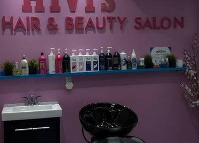 Hivi's Hair & Beauty Salon in Hamilton, Ontario, CA features a stylish wash station with vibrant decor.