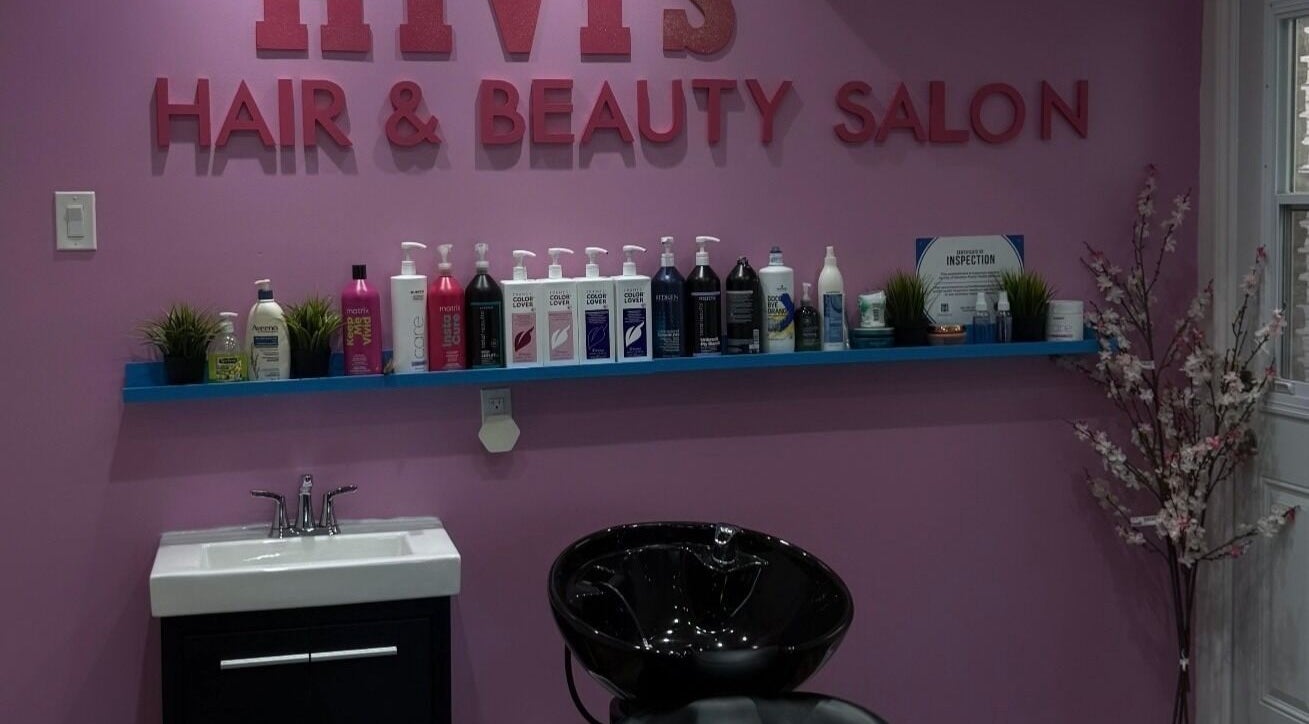 Hivi's Hair & Beauty Salon in Hamilton, Ontario, CA features a stylish wash station with vibrant decor.