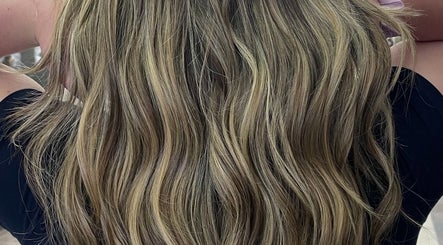 Styled wavy blonde hair at Hivi's Hair & Beauty Salon, Hamilton, Ontario, CA for a luxurious look.