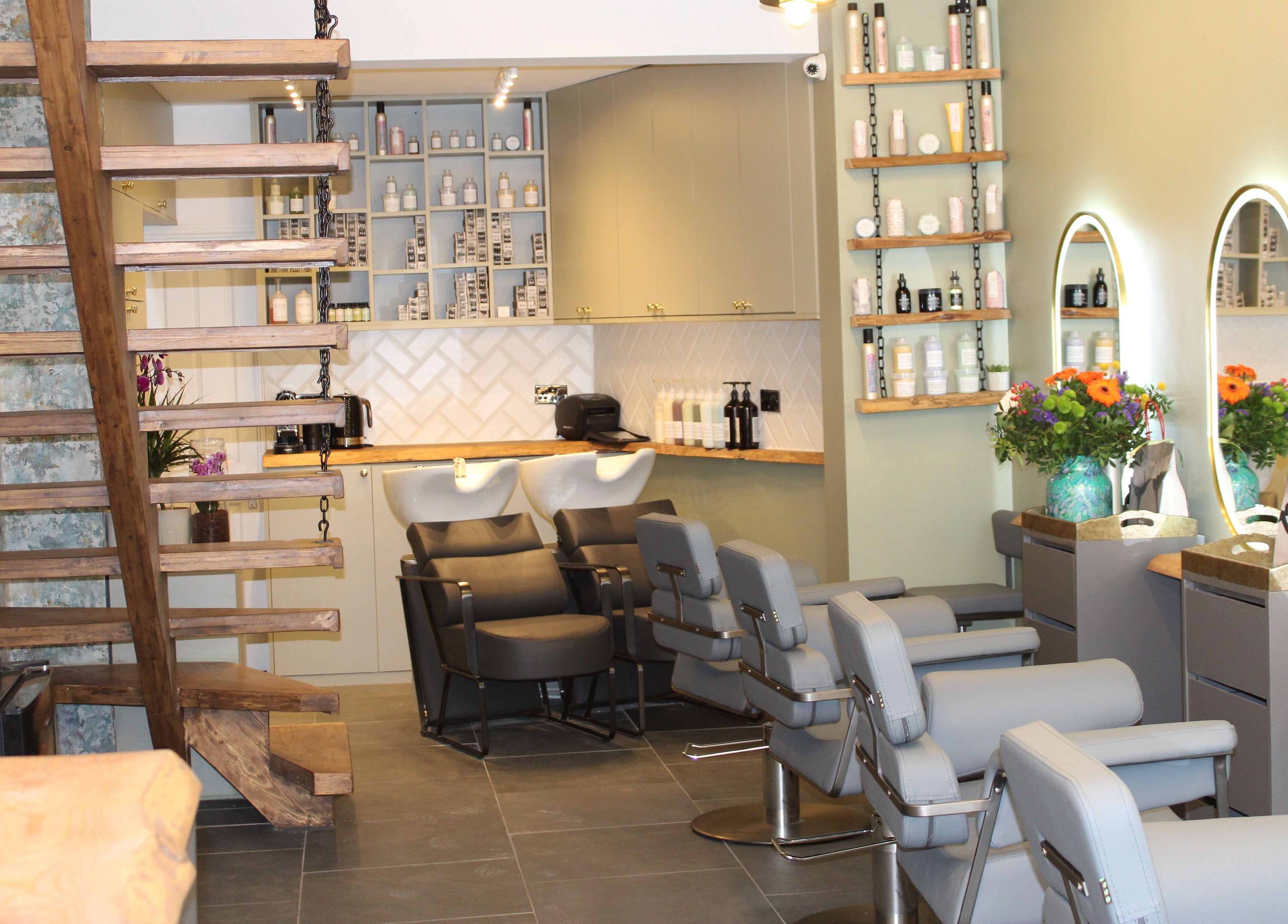 Modern interior of Hair Spring Studio, London, England, GB showcasing stylish chairs and mirrors.