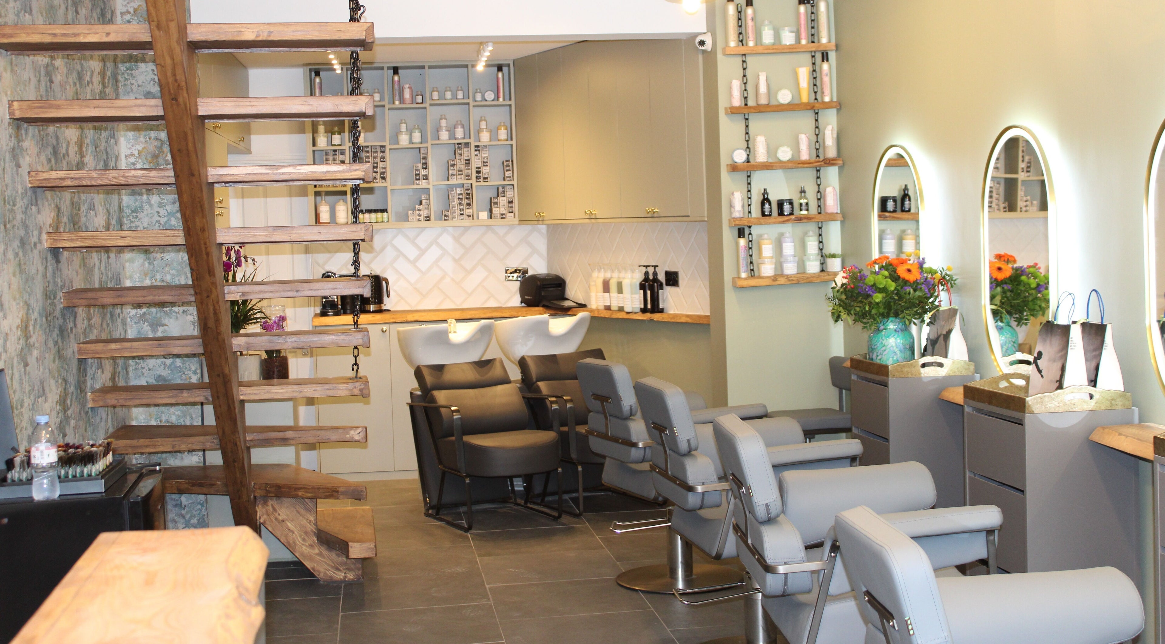 Modern interior of Hair Spring Studio, London, England, GB showcasing stylish chairs and mirrors.