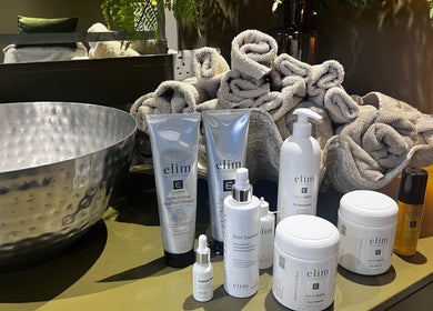 Luxurious skincare products and towels at Fig Tree Cabin, Box, England, GB, perfect for wellness retreats.