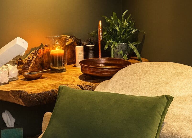 Cozy wellness corner at Fig Tree Cabin, Box, England, GB with candles and greenery for a relaxing atmosphere.