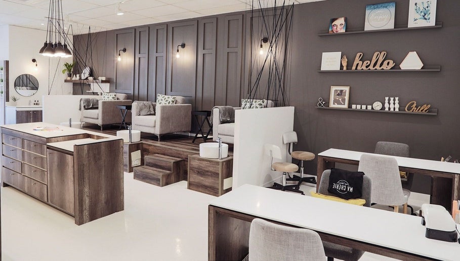 Elegant interior of Ma Cherie Nails + Beauty in Johannesburg, Gauteng, ZA, featuring cozy chairs and chic decor.