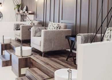 Elegant pedicure setup at Ma Cherie Nails + Beauty, Johannesburg, Gauteng, ZA, featuring plush seating and foot baths.