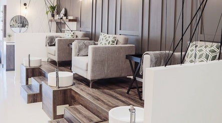 Elegant pedicure setup at Ma Cherie Nails + Beauty, Johannesburg, Gauteng, ZA, featuring plush seating and foot baths.