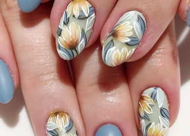 Intricate floral nail art at Ma Cherie Nails + Beauty, Johannesburg, Gauteng, ZA. Stunning craftsmanship displayed.