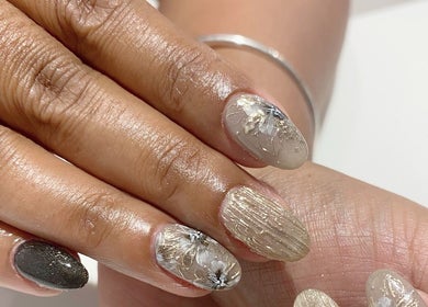 Elegant nail art at Ma Cherie Nails + Beauty, Johannesburg, Gauteng, ZA. Featuring gold and floral designs.