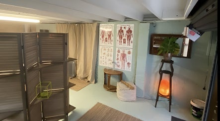 Therapy corner with anatomical charts at Natural Edge Beulah Therapy, Devonport, Tasmania, AU.