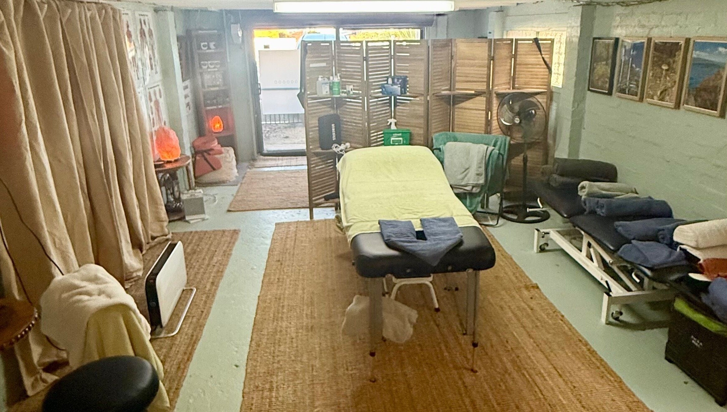 Cozy therapy room at Natural Edge Beulah Therapy, Devonport, Tasmania, AU with massage table and serene decor.