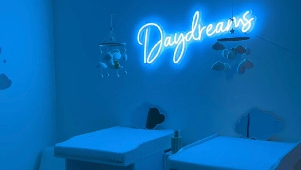 Daydreams Infant Massage nursery with neon sign and cloud decor in Dianella, Western Australia, AU.