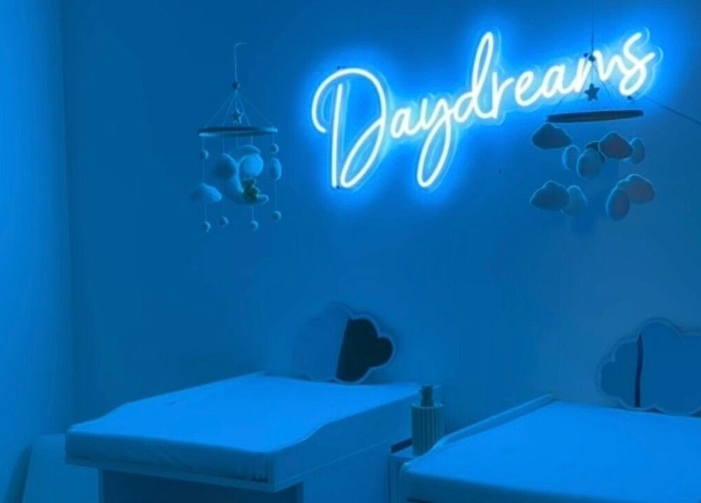 Daydreams Infant Massage nursery with neon sign and cloud decor in Dianella, Western Australia, AU.