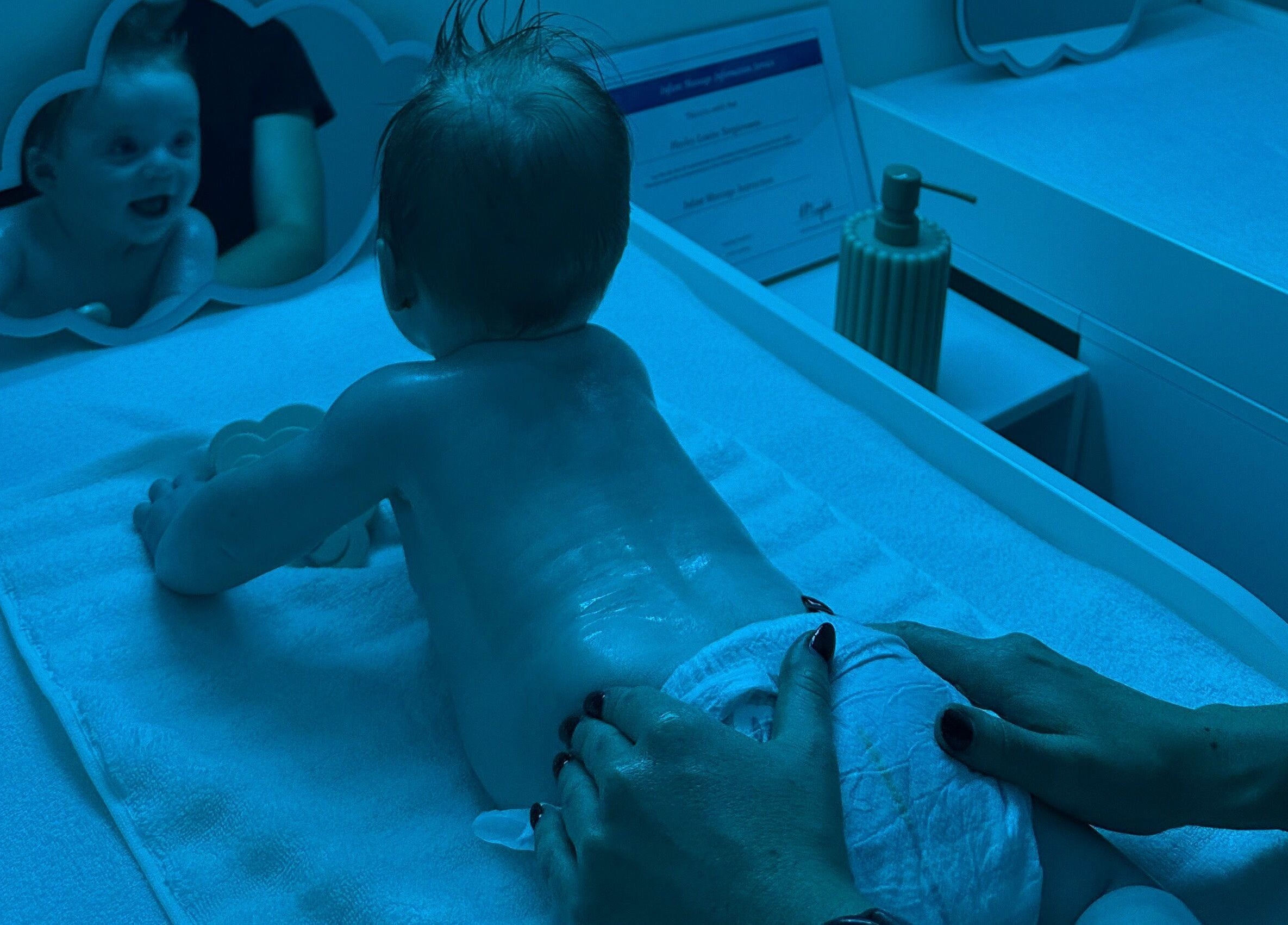 Baby enjoys a soothing massage at Daydreams Infant Massage in Dianella, Western Australia, AU.