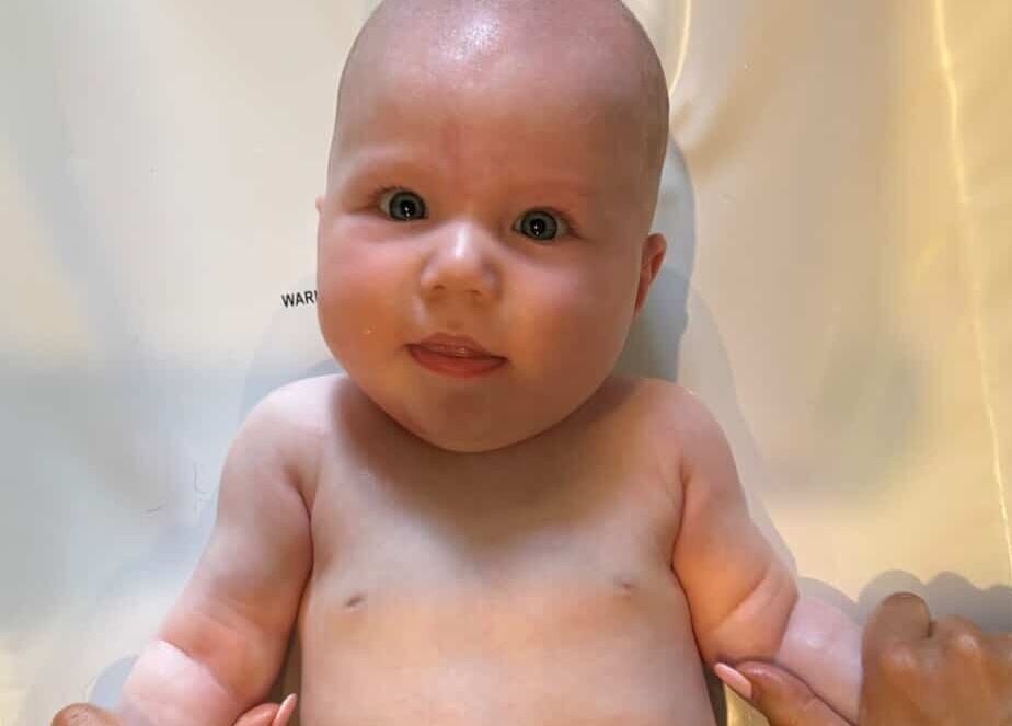 A serene infant enjoying massage at Daydreams Infant Massage in Dianella, Western Australia, AU.