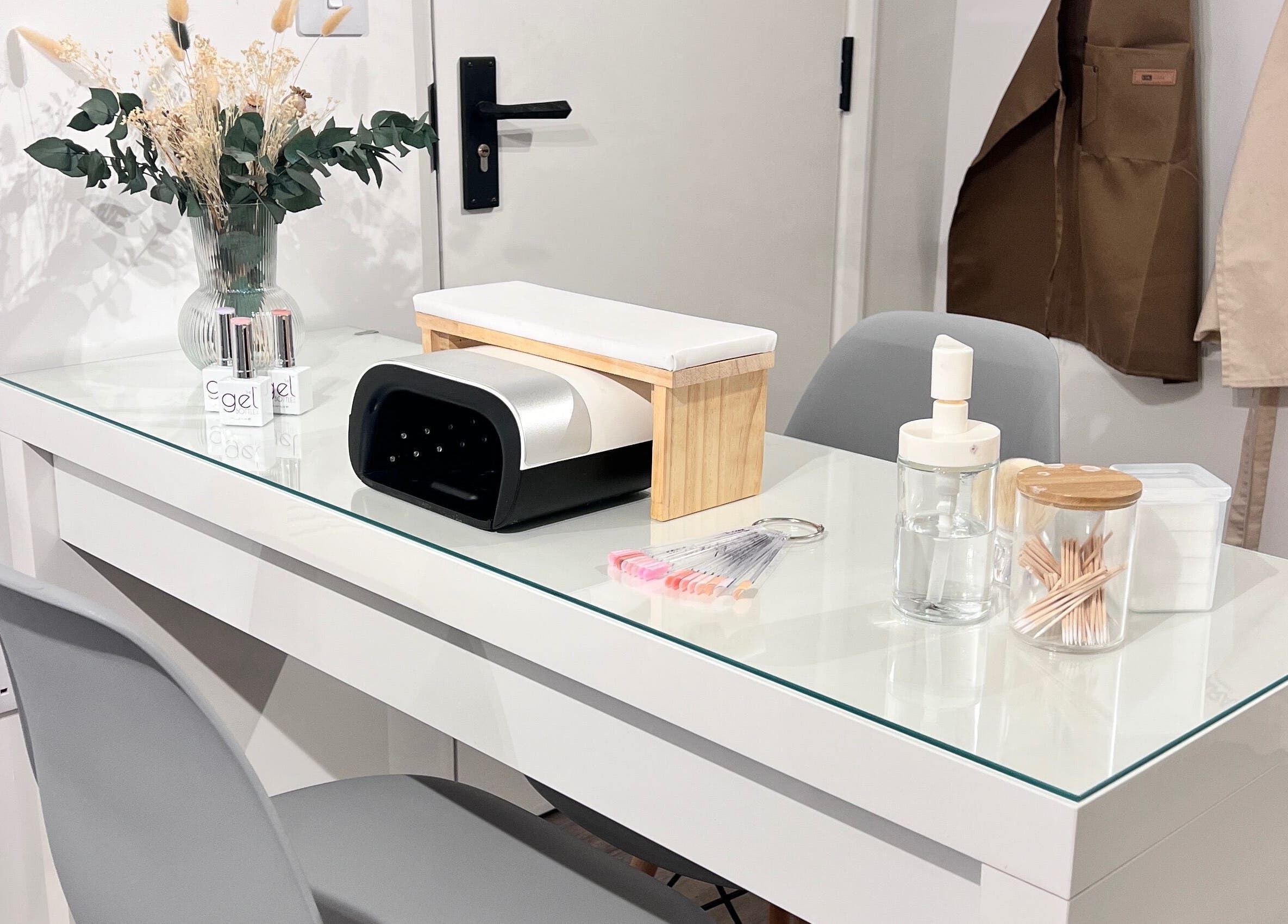 Manicure station at A Touch of Beauty by Jasmine Charlotte in Hereford, England, GB, showcasing tools and decor.