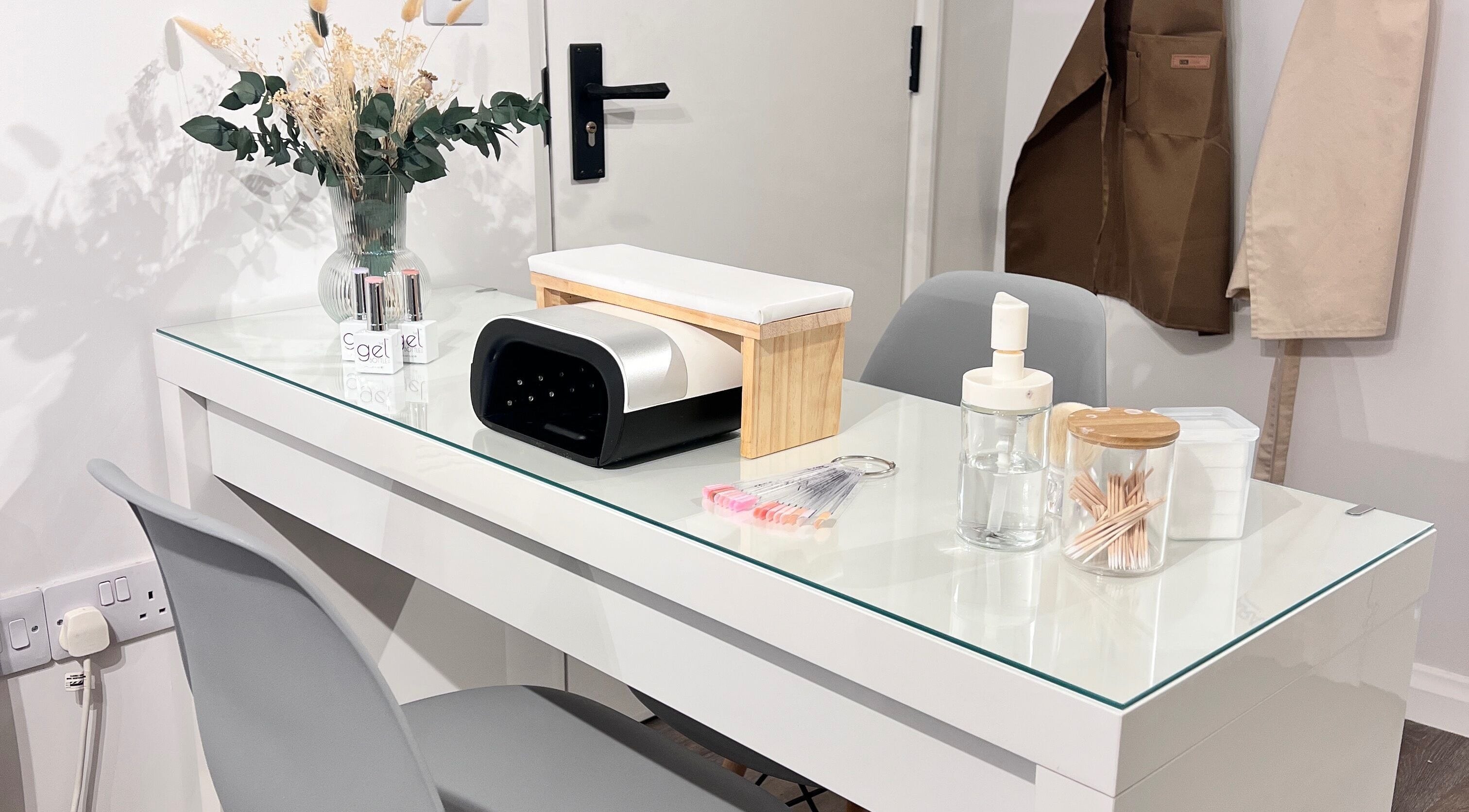 Manicure station at A Touch of Beauty by Jasmine Charlotte in Hereford, England, GB, showcasing tools and decor.