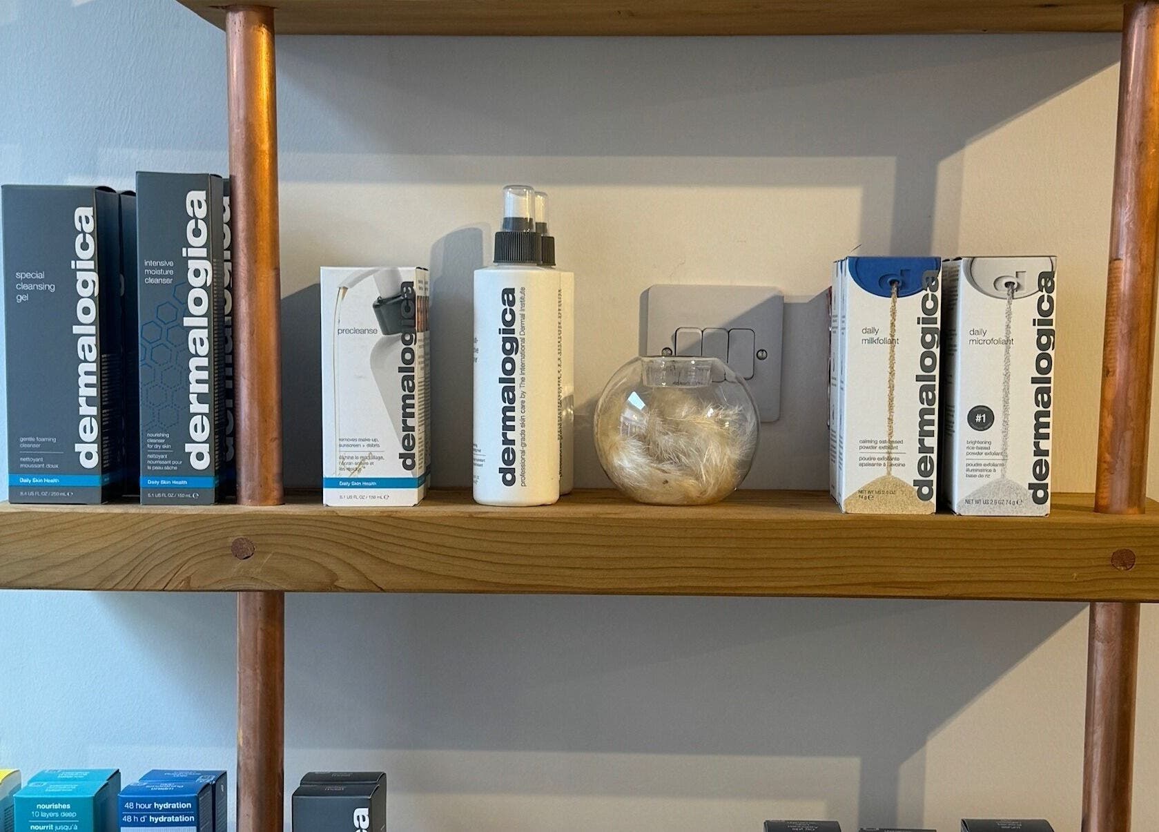 Dermalogica products on wooden shelf at A Touch of Beauty by Jasmine Charlotte, Hereford, England, GB.