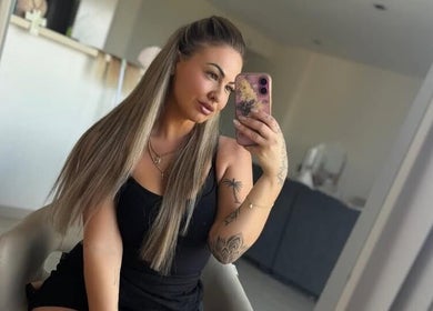 Stylish woman taking a mirror selfie at Kira Lee, Bateau Bay, New South Wales, AU.