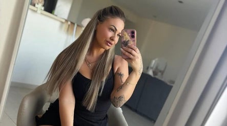 Stylish woman taking a mirror selfie at Kira Lee, Bateau Bay, New South Wales, AU.